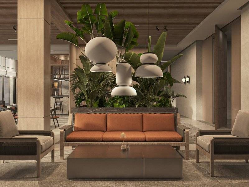 Lobby des Jaz Elite Amara Hotels mit Sofa, Sesseln und Pflanzen