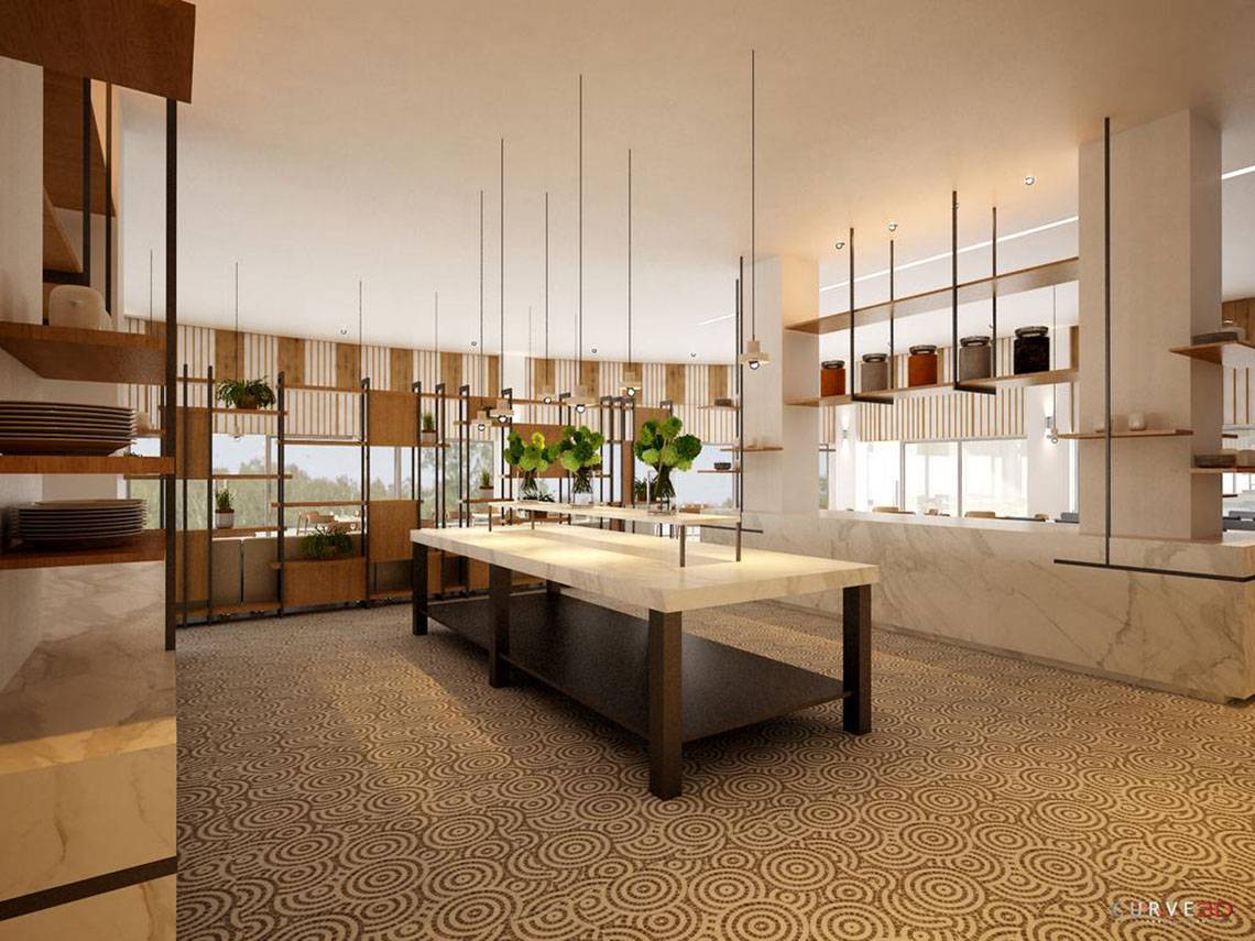 Innenbereich des NissiBlu Beach Resort mit modernem Design, Marmortischen und hängenden Pflanzen.