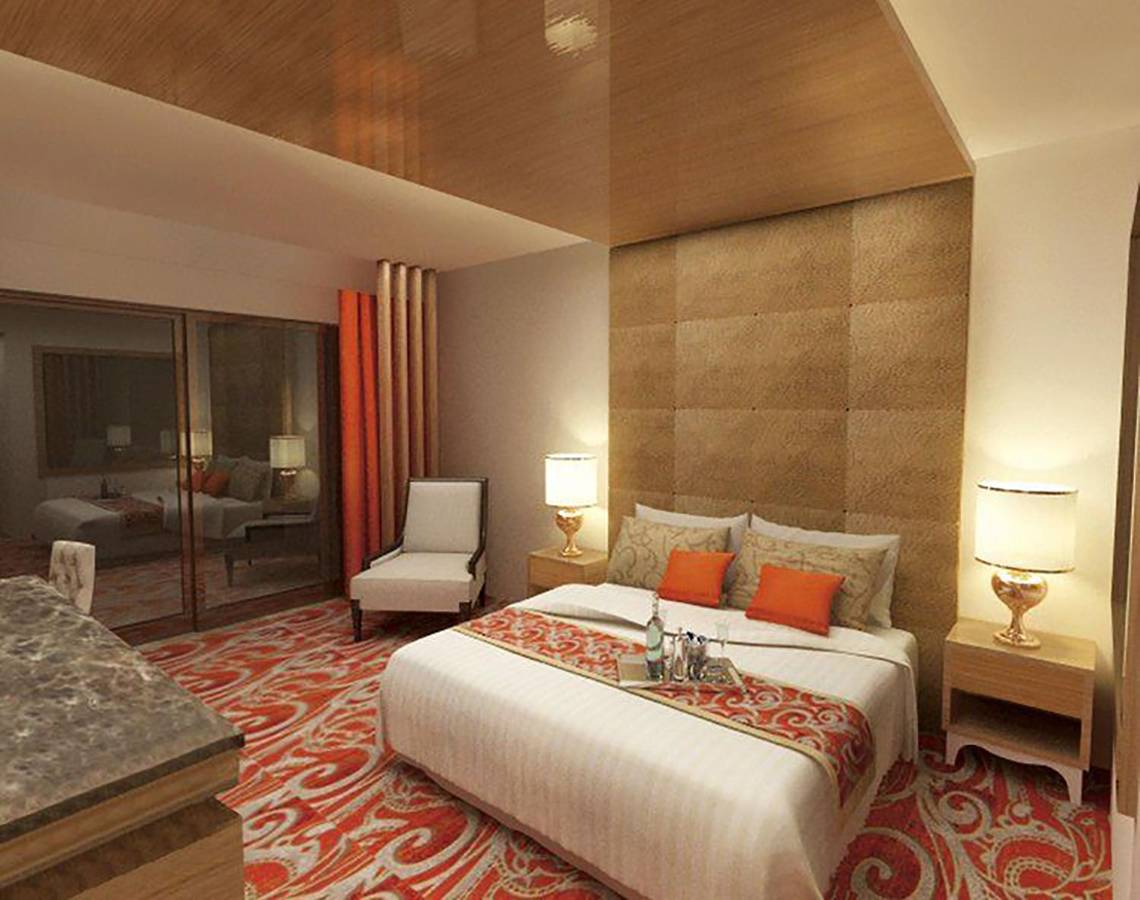 Hotelzimmer im Defne Defnem mit einem großen Bett, zwei Nachttischen und Lampen.
