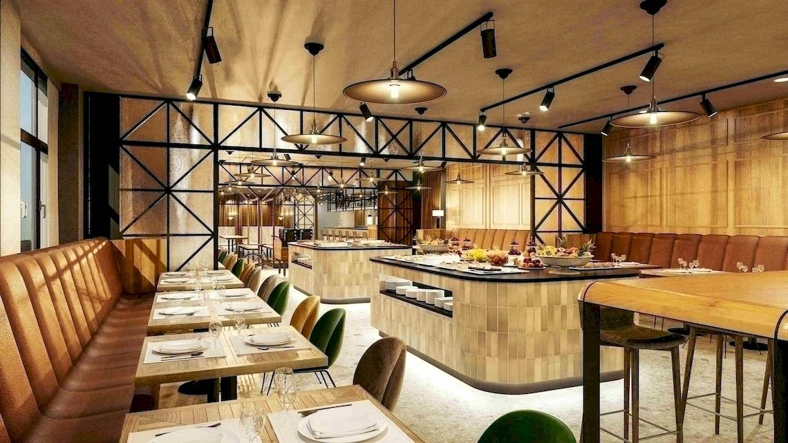 Innenansicht des Restaurants im NH Hamburg Altona mit gepolsterten Bänken und Tischen.
