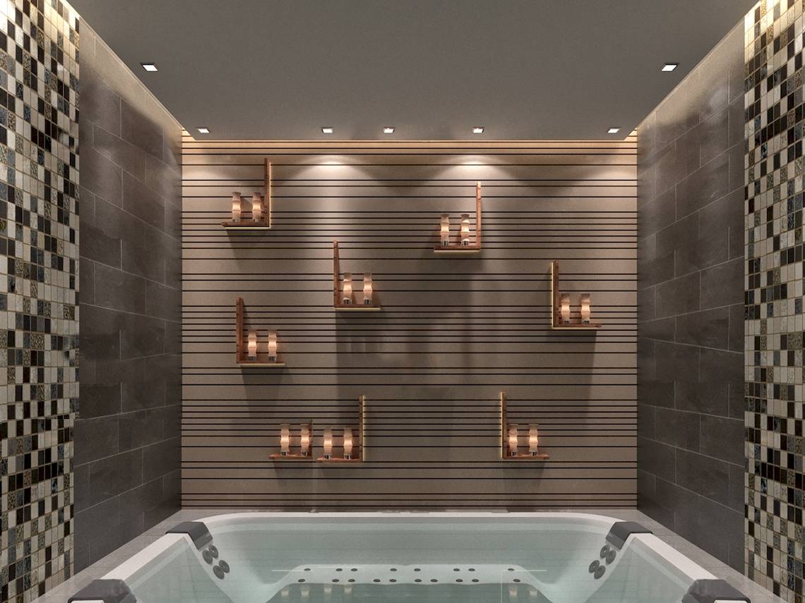 Innenansicht des Badezimmers im Belad Bont Resort mit Badewanne und dekorativen Wandleuchten.