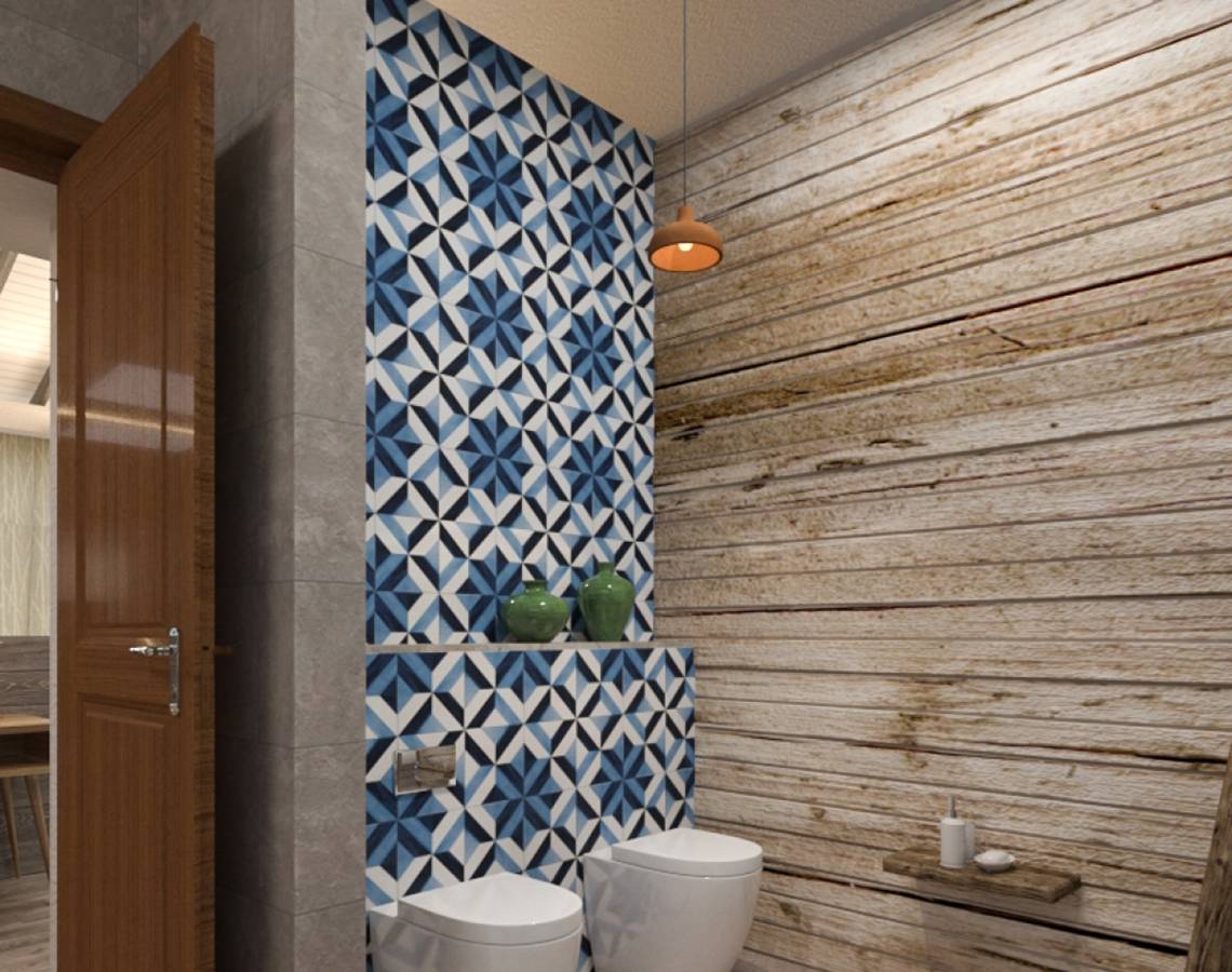 Ein Badezimmer mit blau-weißen geometrischen Fliesen und einer Holzwand.