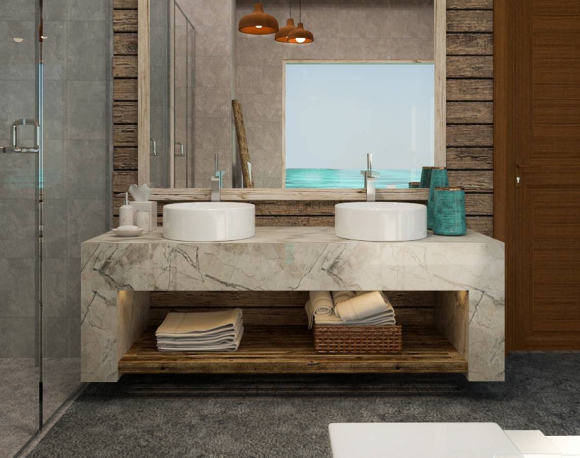 Badezimmer im You & Me Maldives Hotel mit Marmor-Waschtisch und Holzwand.
