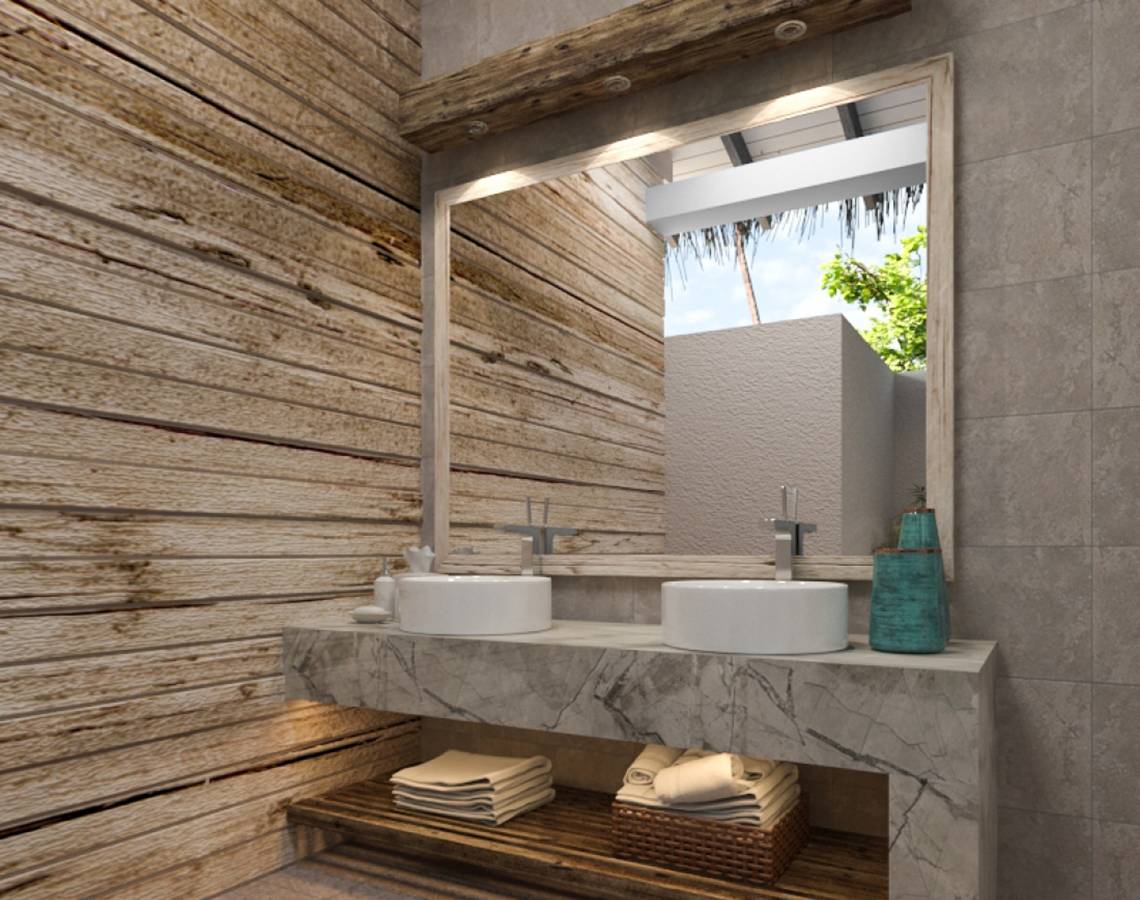 Badezimmer mit Doppelwaschbecken und Holzwand im You & Me Maldives Hotel.