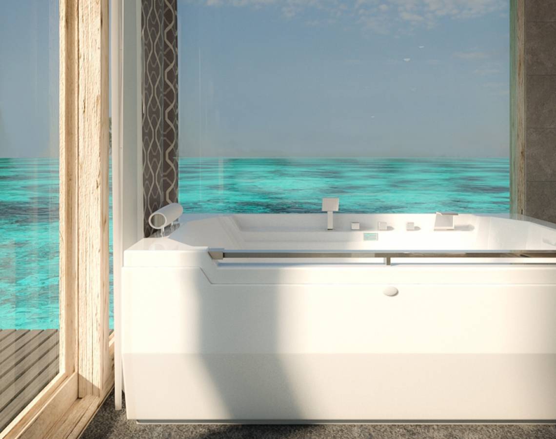 Badezimmer mit Meerblick im You & Me Maldives Hotel, mit Badewanne und großem Fenster.