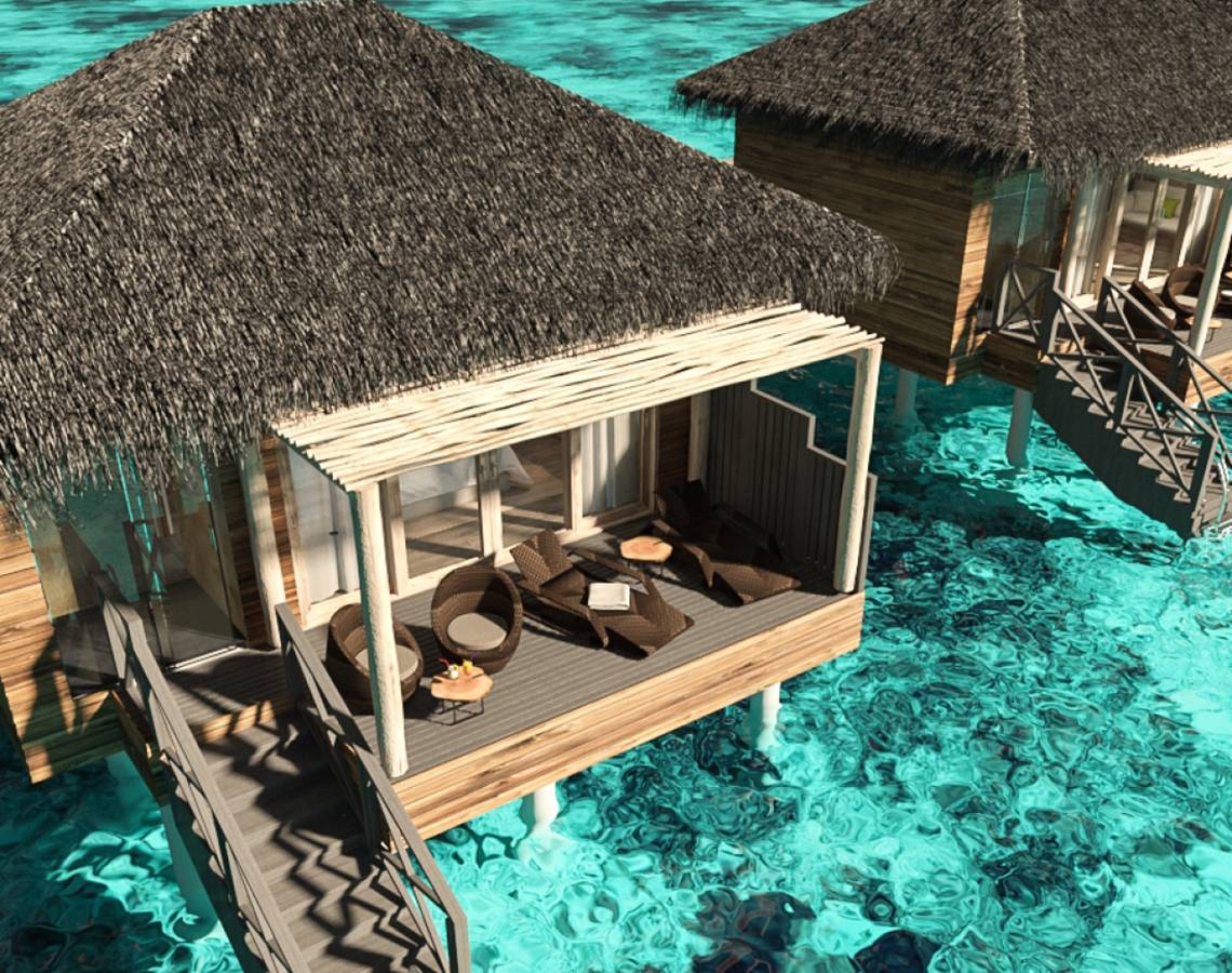 Überwasser Bungalow im You & Me Maldives mit Holzbrücke und Sonnenliegen im Wasser