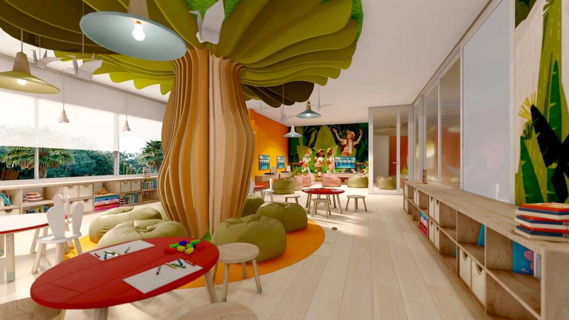 Ein bunt gestaltetes Kinderzimmer im Sunscape Dominicus La Romana mit einer großen Baumstruktur, bunten Möbeln und einer Wandmalerei.