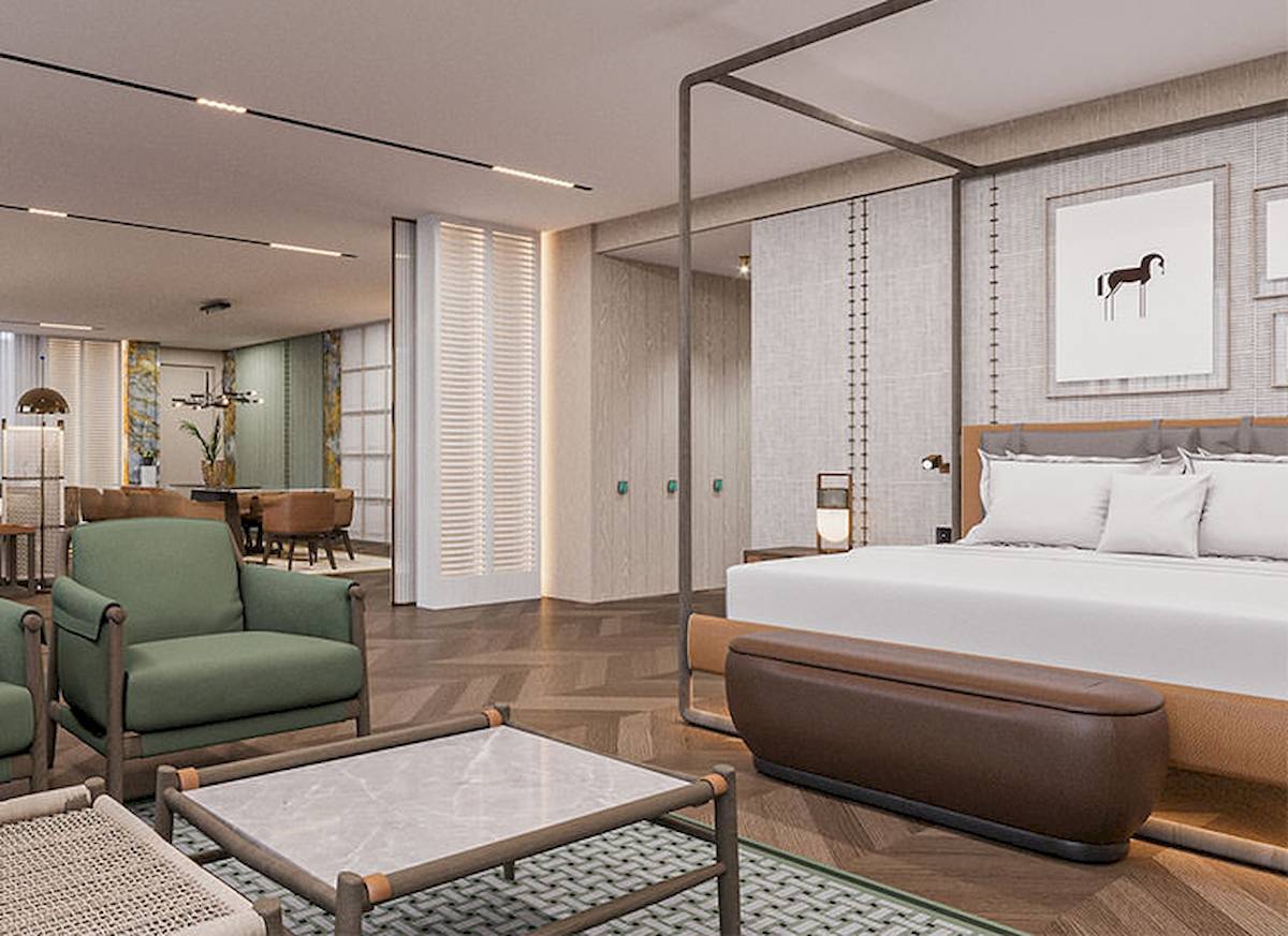 Innenansicht des Schlafzimmers im Gloria Serenity Resort mit modernem Bett, Sitzmöbeln und dekorativen Elementen.