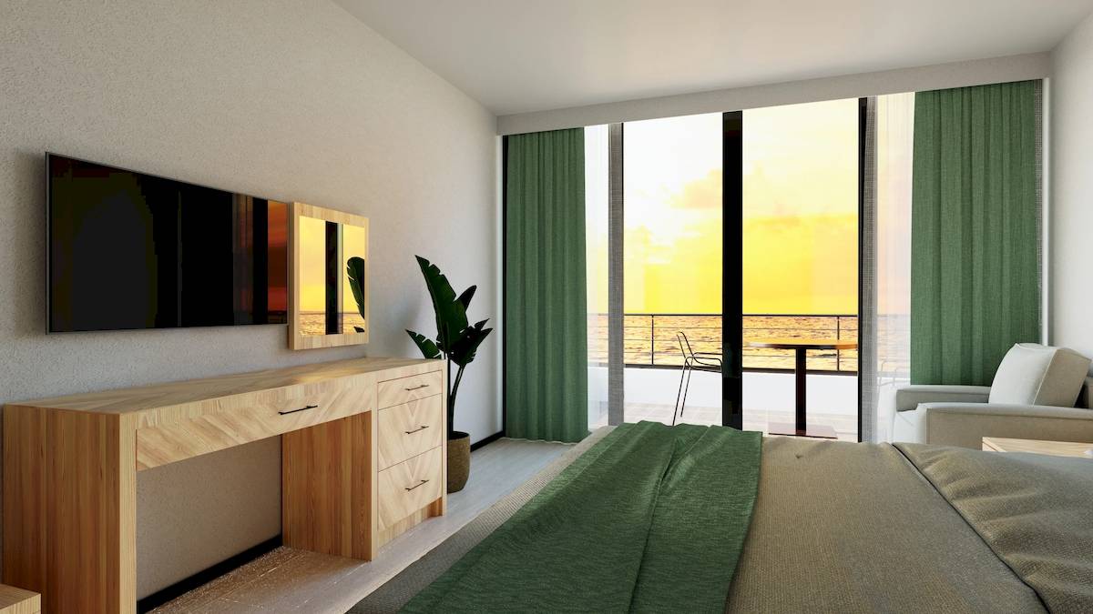 Modernes Schlafzimmer mit Balkon und Meerblick im Sunrise Queen Luxury Hotel.