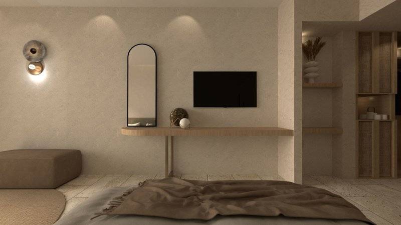 Ein modernes Zimmer im Alexandra Beach Resort mit einer weißen Wand, einem großen Spiegel, einem Fernseher und einem kleinen Tisch.