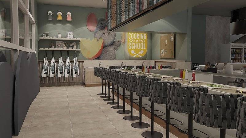 Innenansicht der Küchenschule im Ethno Belek Hotel mit Kochutensilien und Tischanordnung.