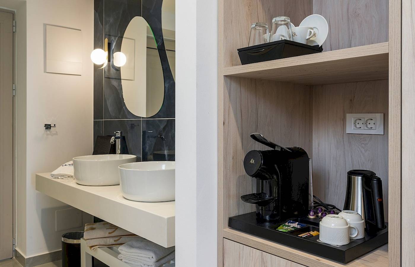 Badezimmer im Vantaris Palace Hotel mit Waschbecken, Kaffeemaschine und elektrischem Wasserkocher