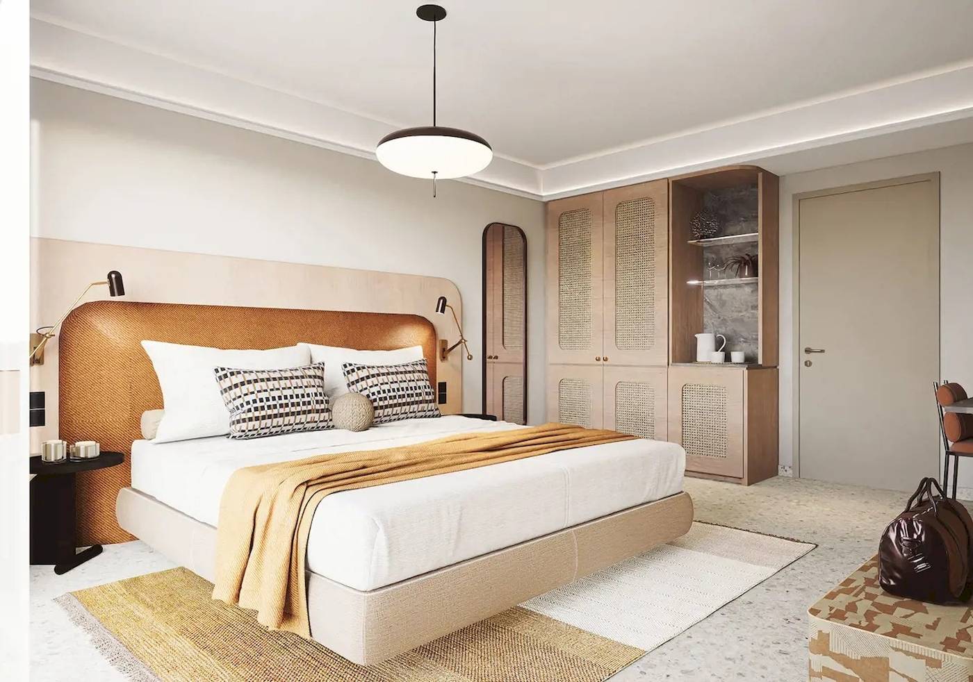 Innenansicht eines Schlafzimmers im Cactus Village Hotel mit einem großen Bett, Dekor und Möbeln.