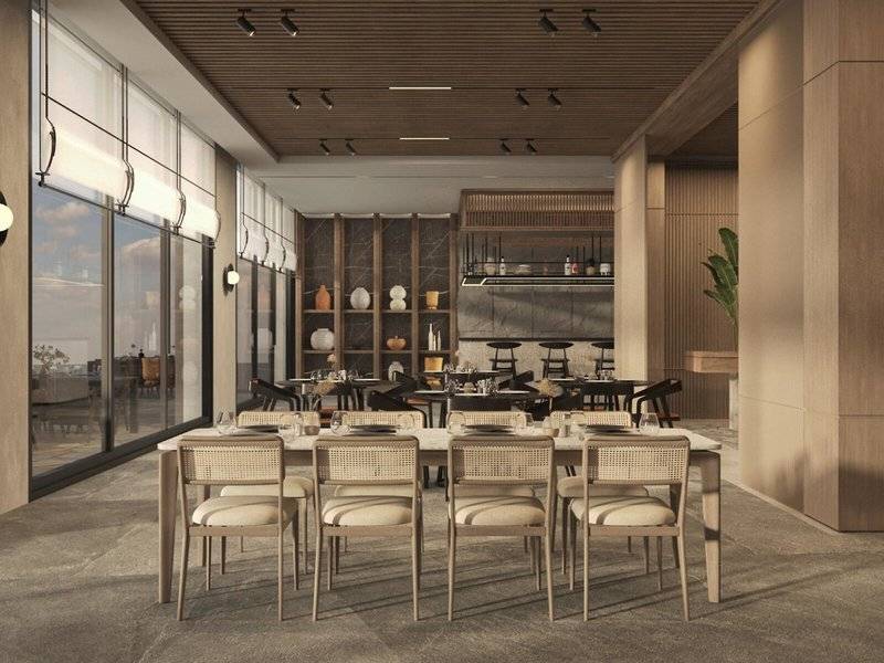 Innenansicht des Speisesaals im Jaz Elite Amara Hotel mit großen Fenstern und modernen Möbeln.