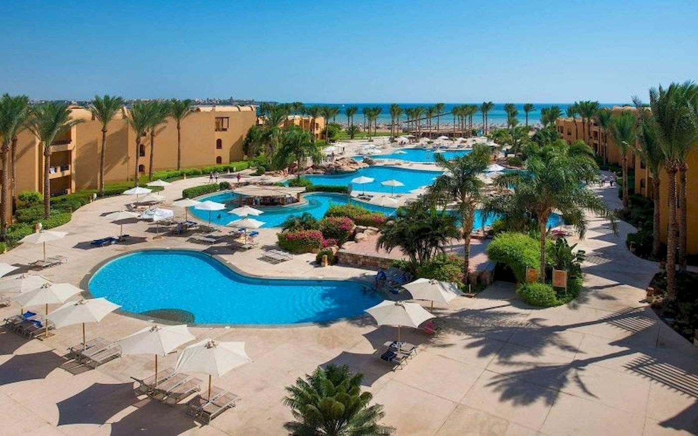 Stella Gardens Resort & Spa Makadi Bay: Pool mit mehreren Wasserbereichen und Liegebereichen