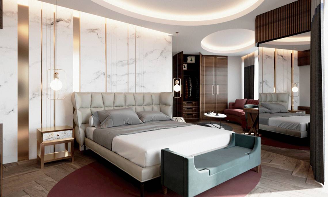 Schlafzimmerdesign im Sherwood Exclusive Lara Hotel mit Marmorwänden, Rundbett, grauen Kissen und einem runden Tisch.