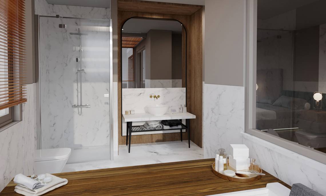 Badezimmer im Sherwood Exclusive Lara Hotel mit weißen Marmorwänden, einer Dusche und einem Waschtisch.