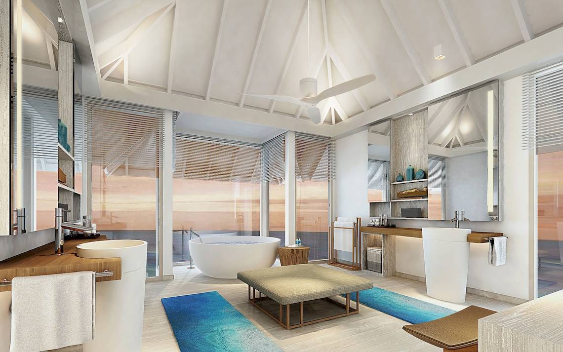 Luxuriöses Badezimmer im LUX South Ari Atoll Hotel mit Badewanne und offenem Ausblick auf den Ozean.