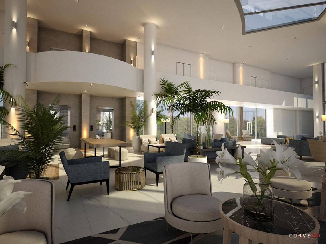 Lobby-Bereich des NissiBlu Beach Resorts mit moderner Inneneinrichtung, runden Tischen und Sesseln.