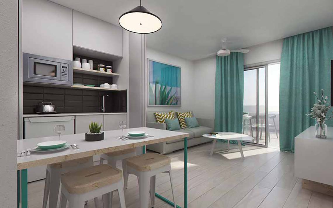 Innendesign eines Zimmers im SBH Maxorata Resort mit Küche, Esstisch und Wohnzimmer