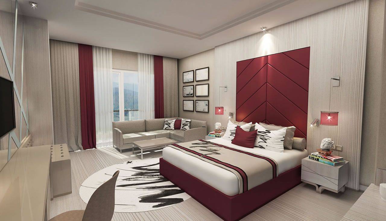 Elegantes Zimmer im Delphin BE Grand Resort mit modernem Design, hochwertigem Mobiliar und großem Fensterblick.