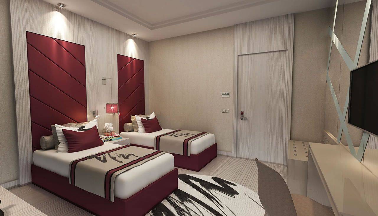 Zwei elegante Einzelbetten in einem modernen Zimmer des Delphin BE Grand Resort, mit stilvollem Dekor und Kontrasten.