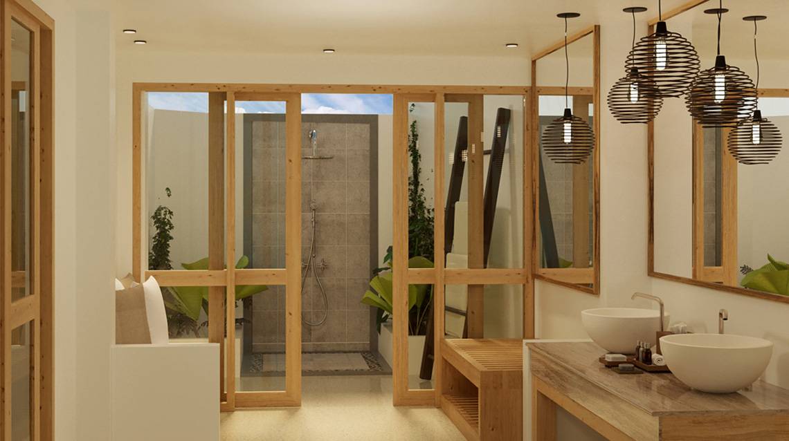 Innenansicht eines Badezimmers im Ellaidhoo Maldives by Cinnamon mit Holztüren, Dusche und zwei Waschbecken.