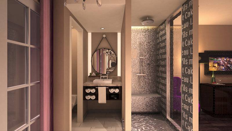 Innenansicht eines Badezimmers im Cromwell Las Vegas Hotel & Casino mit Spiegel, Waschbecken und gefliester Wand.