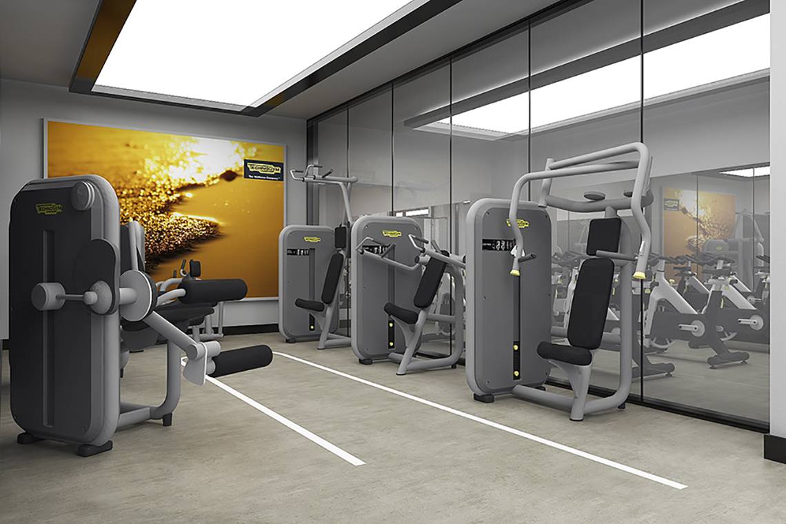 Fitnessraum im Rixos Premium Seagate mit moderner Fitnessgeräten und einer großen Wandmalerei.