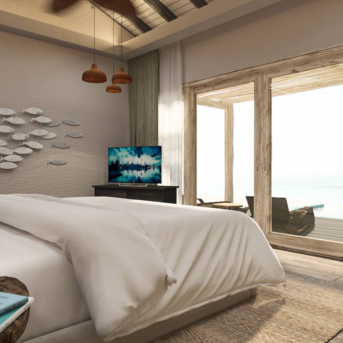 Schlafzimmer mit Bett, Fernseher und Meerblick im You & Me Maldives