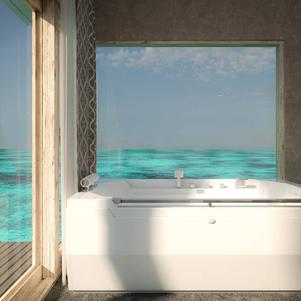 Badezimmer mit Meerblick im You & Me Maldives Hotel, mit Badewanne und großem Fenster.