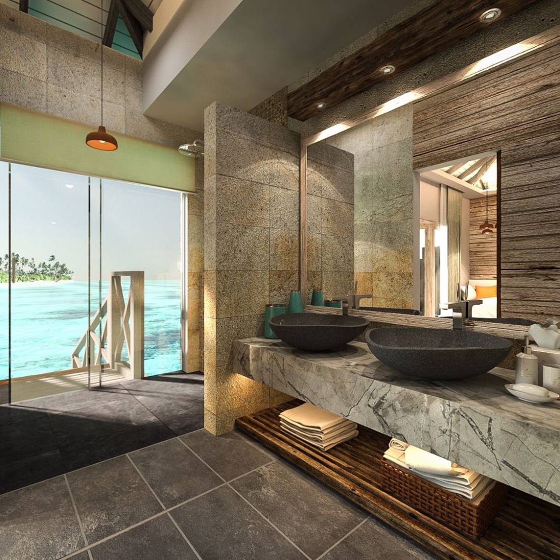 Badezimmer mit Meerblick im You & Me Maldives Hotel, mit zwei Waschbecken und einer großen Glastür.