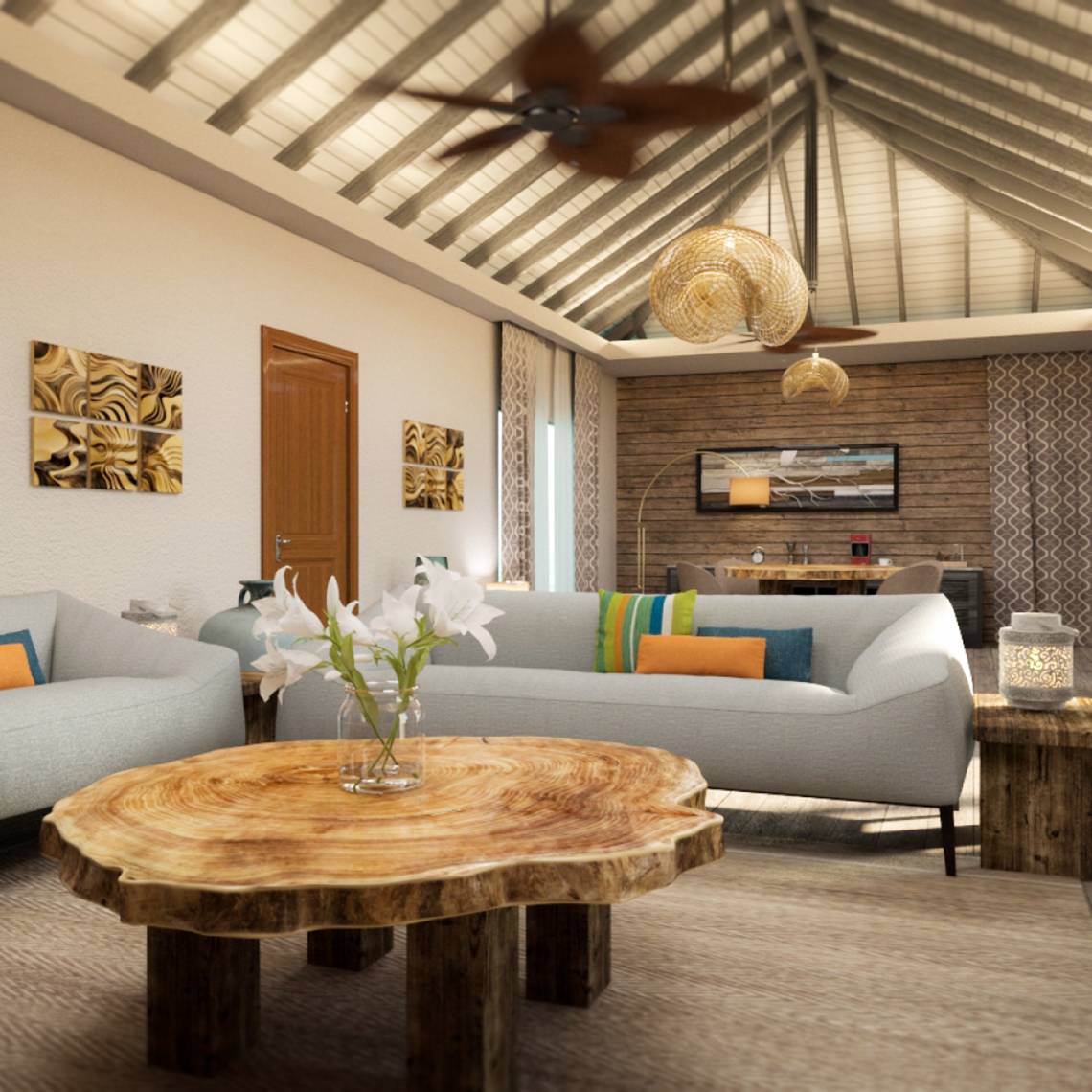 Wohnzimmer von You & Me Maldives mit Couch, Tisch und Dekoration.