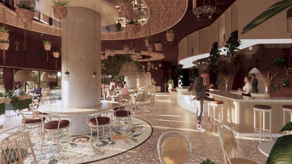 Inneneinrichtung des Liu Resorts mit Loungebereich, Bar und runden Tischen.