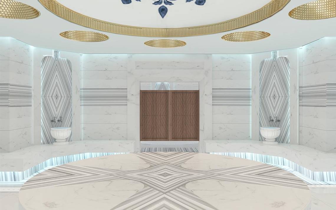 Innenraum Design des Lago Hotels mit Marmorboden, weißen Wänden und goldenen Deckenelementen.