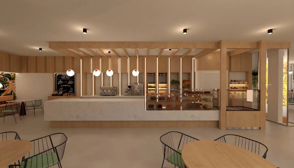 Innenansicht des Cafés im Sunscape Dominicus La Romana mit modernen Holzmöbeln, einer Theke und Tisch-Sets.