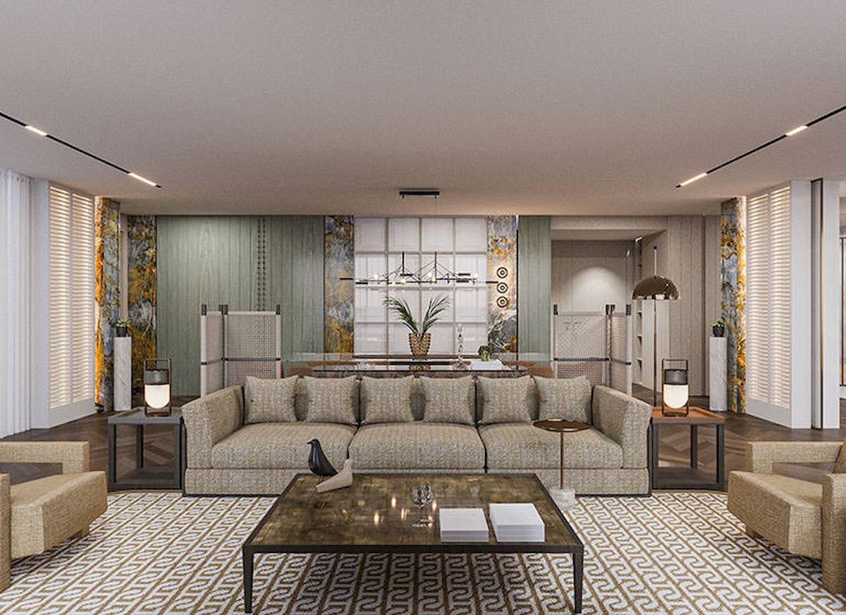 Wohnbereich im Gloria Serenity Resort mit Sofas, Tisch und modernen Leuchten.