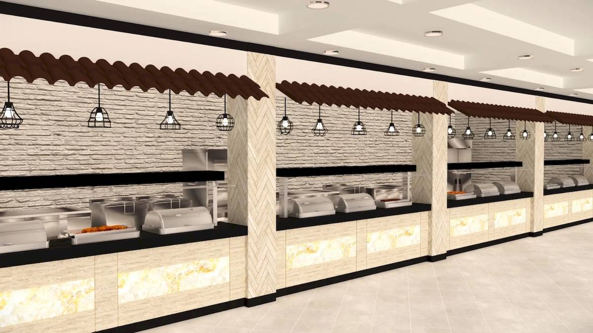 Innenansicht des Buffetbereichs im Sunrise Queen Luxury Hotel mit mehreren Edelstahl-Buffetstationen, braunen Dächern und Beleuchtung.