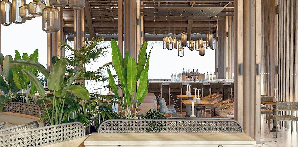 Innenbereich des Sunrise Queen Luxury Hotel mit Holzelementen, Pflanzen und Sitzbereichen.