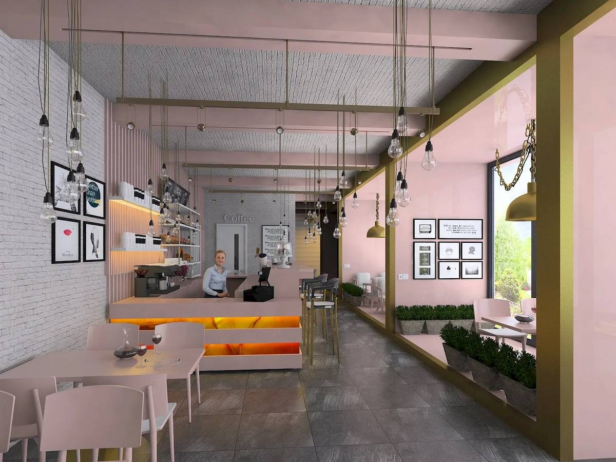 Innenansicht eines Cafés mit einer Frau am Tresen, pinken Wänden, weißen Bänken, und grünen Pflanzen.