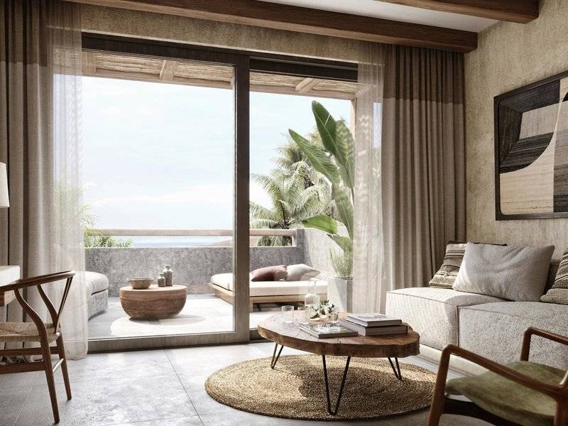 Wohnzimmer des JAZ Riviera Hotels mit großer Terrasse und Meerblick.