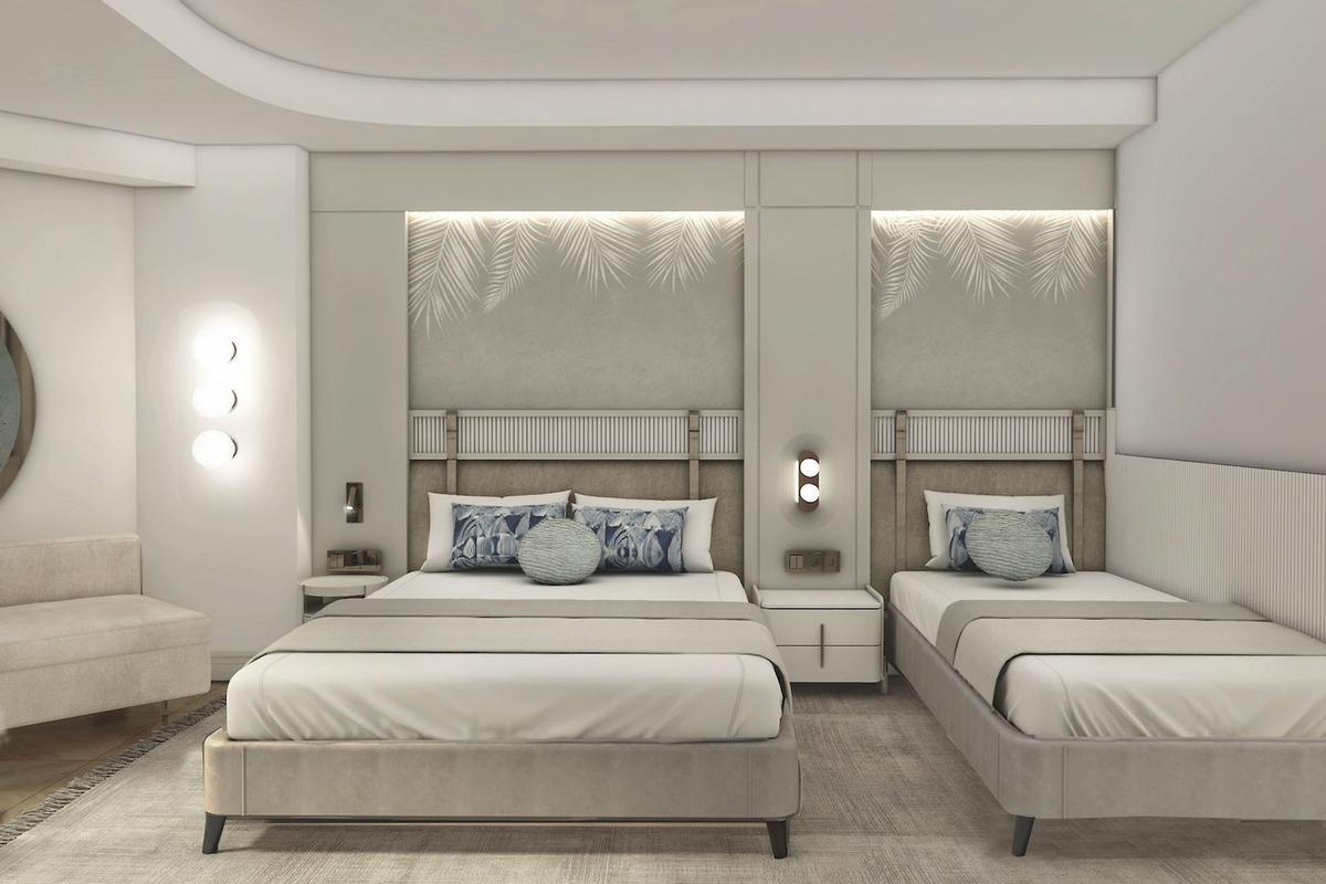Doppelbett-Zimmer im Delphin Palace Hotel mit weißen Wänden, grauen Betten und Palmblattmustern.