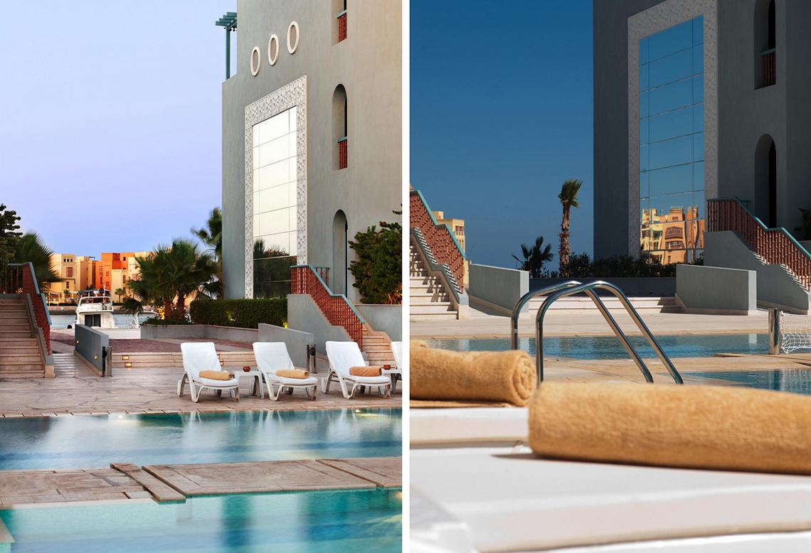 Poolbereich des Fanadir Hotel El Gouna mit Loungestühlen und moderner Architektur.