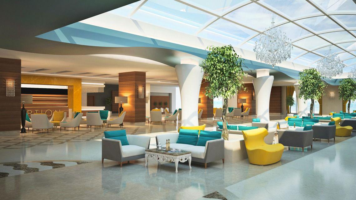 Innenansicht der Lobby des Adalya Ocean Deluxe Hotels mit vielen Stühlen und Tischen.