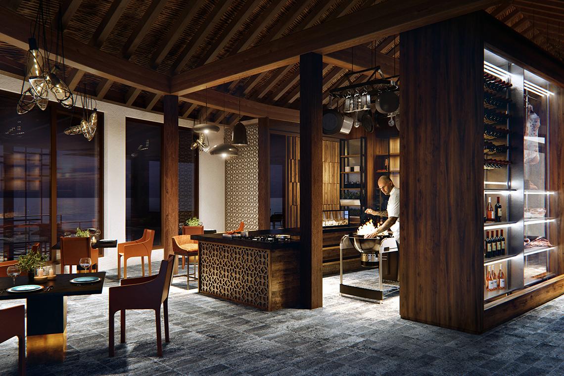 Innenbereich der Küche im JW Marriott Maldives Resort & Spa mit Holzelementen und offenem Kamin.