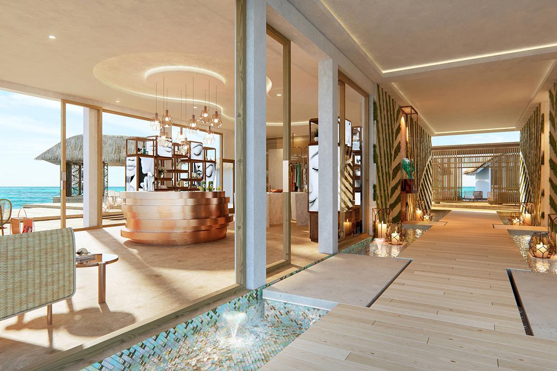 Innenansicht des Empfangsbereichs im JW Marriott Maldives Resort & Spa mit Blick auf den Ozean.