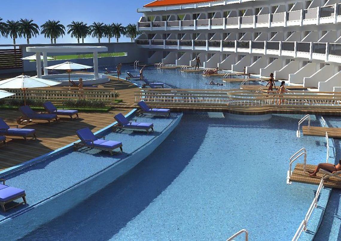 Poolbereich des Ephesia Holiday Beach Club Hotels mit Loungestühlen und Besuchern