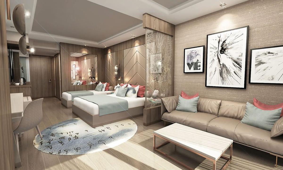Innenansicht eines Hotelzimmers im Delphin BE Grand Resort mit zwei Betten, einem Sofa und Kunstwerken an der Wand.