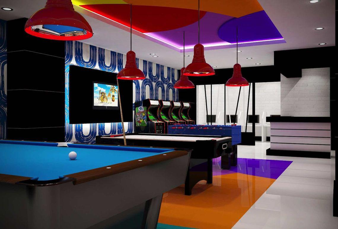 Spielzimmer im Side Orange Palace Hotel mit Billardtischen, Arcade-Spielen und einer Fernsehwand.