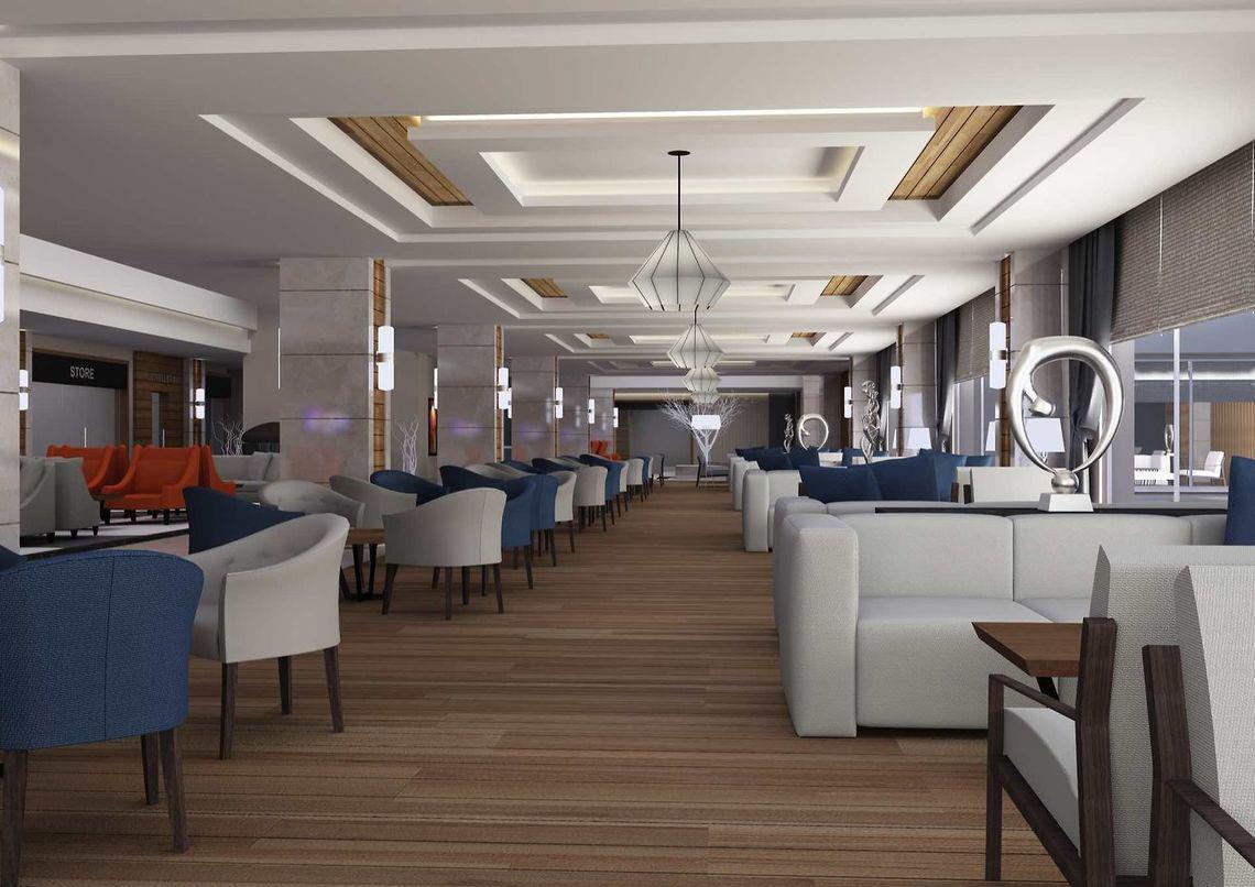 Innenansicht der Lobby des Side Sunport Hotel & Spa mit Holzboden, modernen Möbeln und Kunstwerken.